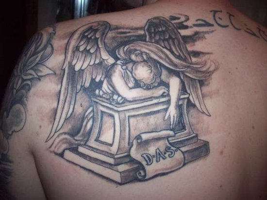 Sad Angel Tattoo On Back