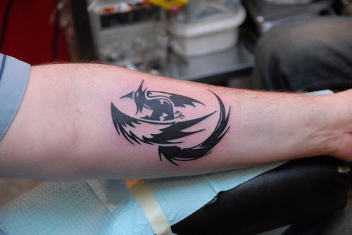 Tribal Bird Tattoo On Arm