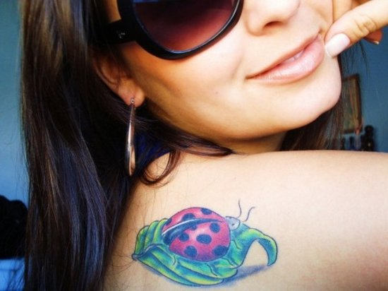 Pretty Girl Showing her Ladybug Tattoo