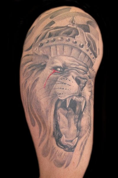 Aggressive Lion Tattoo on Arm