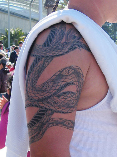 Guy Showing His Snake Tattoo