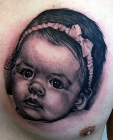 Baby Face Tattoo On Chest