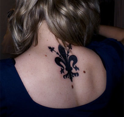 Elegant Fleur de lis Tattoo on Back