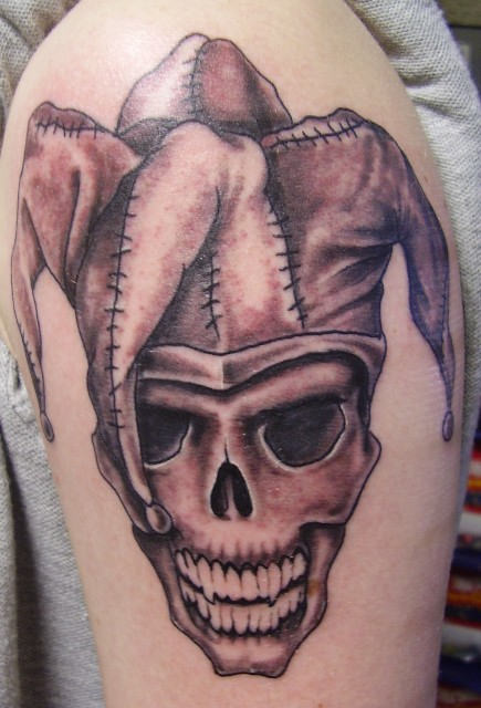 Scary Skull with Clown Cap Tattoo