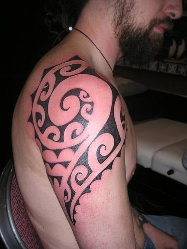 Dude Showing his Hawaiian Tattoo Design
