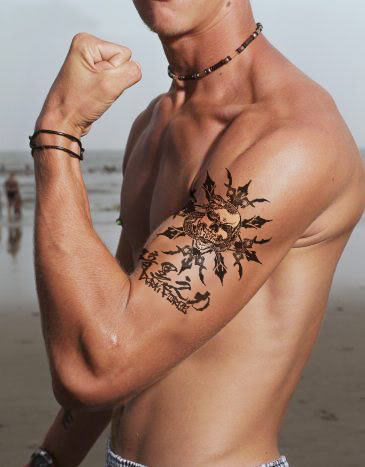Muscular Guy Showing His Bicep Tattoo