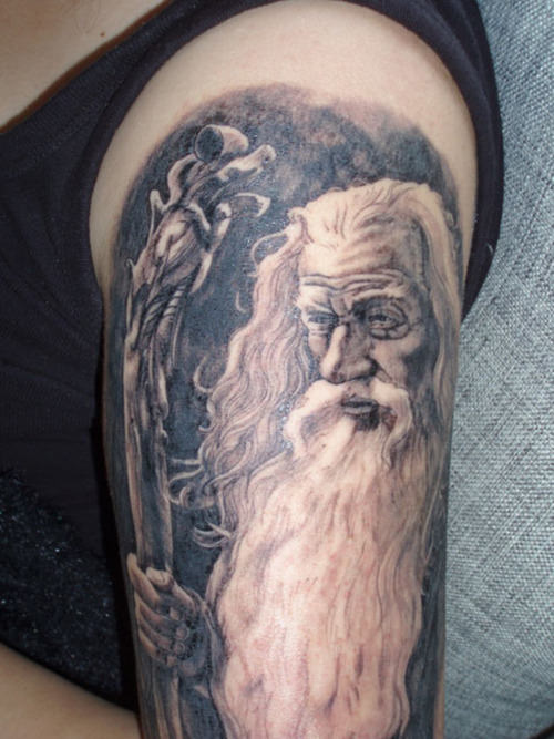 An Old Man Tattoo On Shoulder