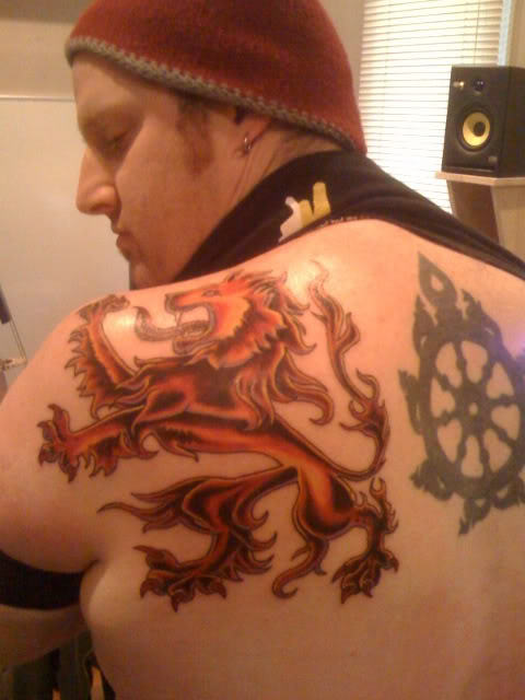 Guy Showing His Stylish Scotland Symbol Tattoo