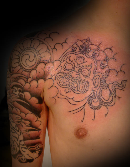 Tibetan Tattoo On Shoulder and Chest