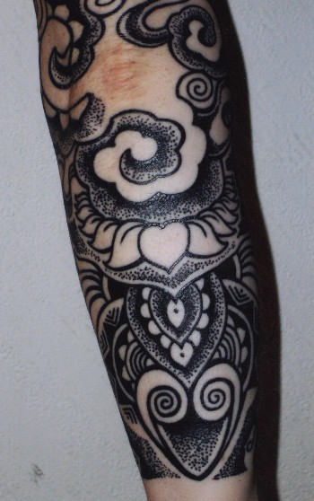 Black Tibetan Tattoo On Arm