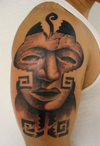 Unique Mask Tattoo On Shoulder