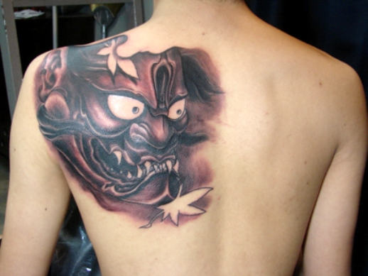 Mask Tattoo On Back