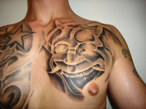 Mask Tattoo On Chest