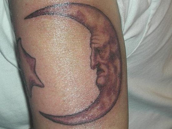 Angry Moon Tattoo On Arm