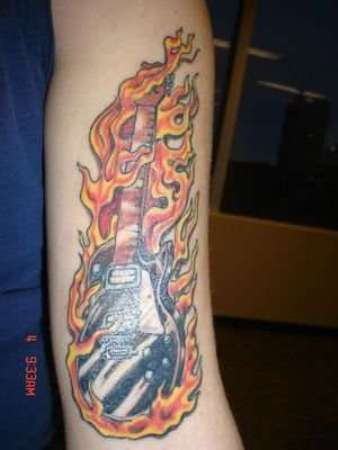 Burning Guitar Tattoo On Arm
