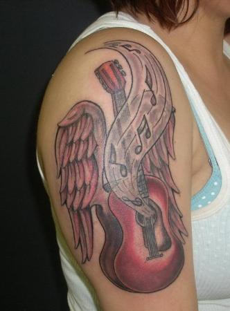 Guitar With Wings Tattoo On Shoulder