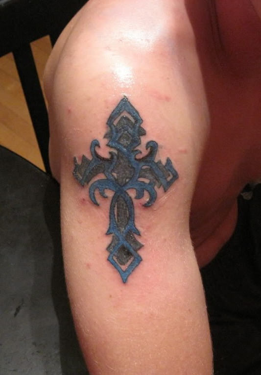 Designing Cross Tattoo On Shoulder