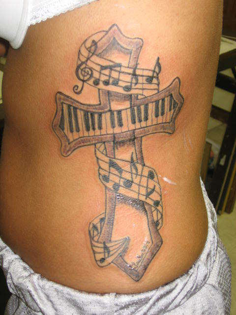 Musical Cross Tattoo On Rib