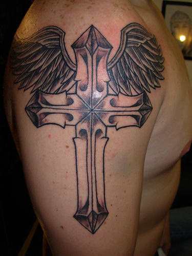 Flying Cross Tattoo On Shoulder