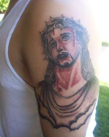 Jesus In Grief Tattoo On Shoulder