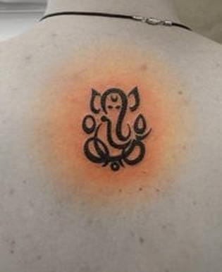 Attractive Ganesh Tattoo On Back