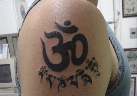 Bold Om Tattoo On Shoulder