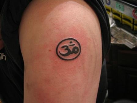 Tiny Om Tattoo On Shoulder