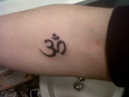 Black Om Tattoo On Arm