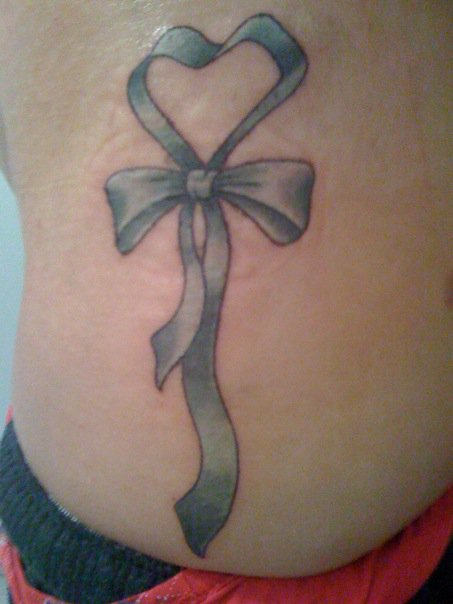 Ribbon Tattoo On Rib