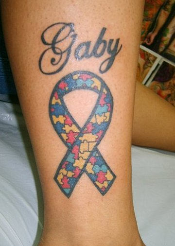 Gaby Ribbon Tattoo On Leg