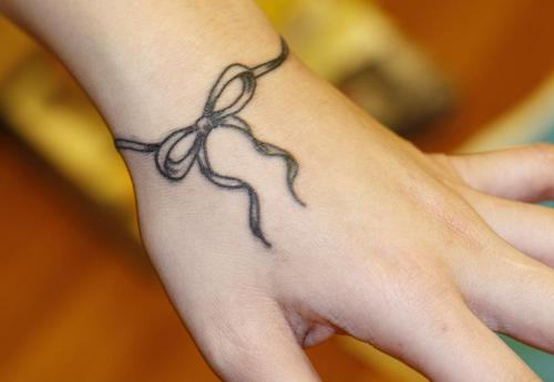 Cool Ribbon Tattoo On Wrist