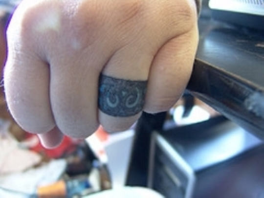 Bold Ring Tattoo On Finger