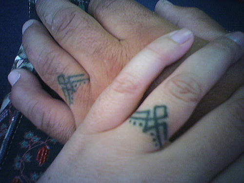 Couple Rings Tattoo On Fingers