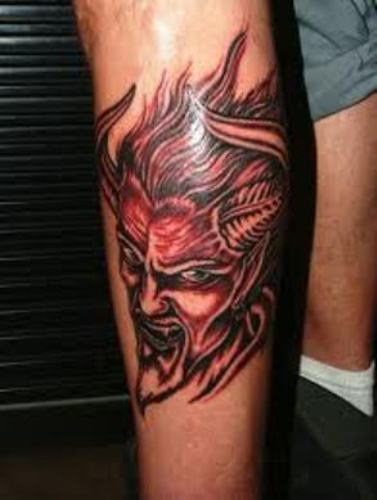 Satan Face Tattoo On Leg