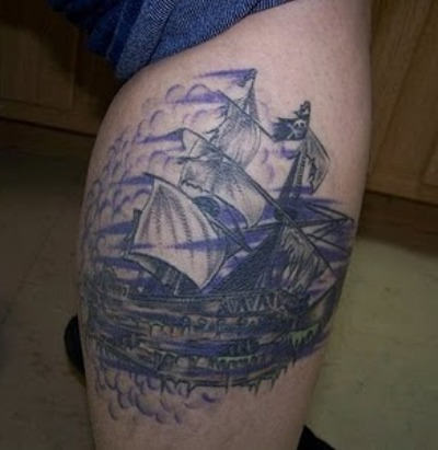Blue Ship Tattoo On Leg
