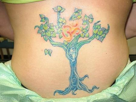 Om Tree Tattoo On Waist