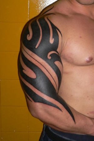 Fabulous Black Tribal Tattoo On Arm