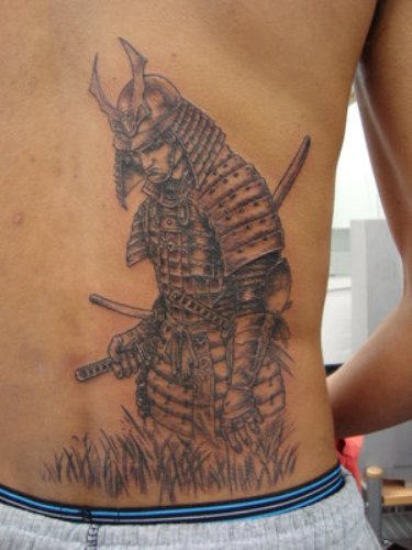 Sad Warrior Tattoo On Back