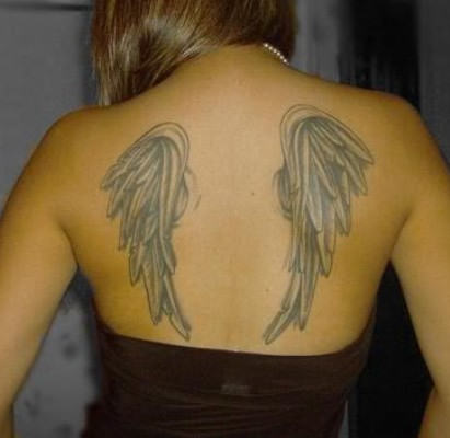 Girl Showing her Pretty Wing Tattoo