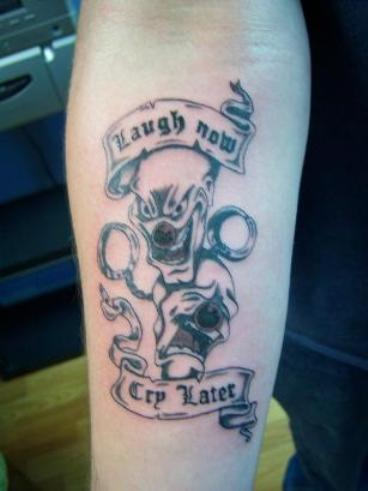 Laugh Now - Cry Later Tattoo on Arm