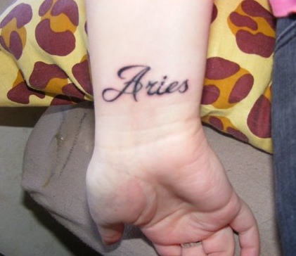 Aries Word Tattoo on Wrist