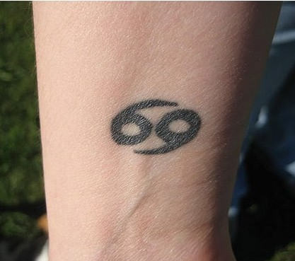 Beautiful Cancer Symbol Tattoo on Wrist