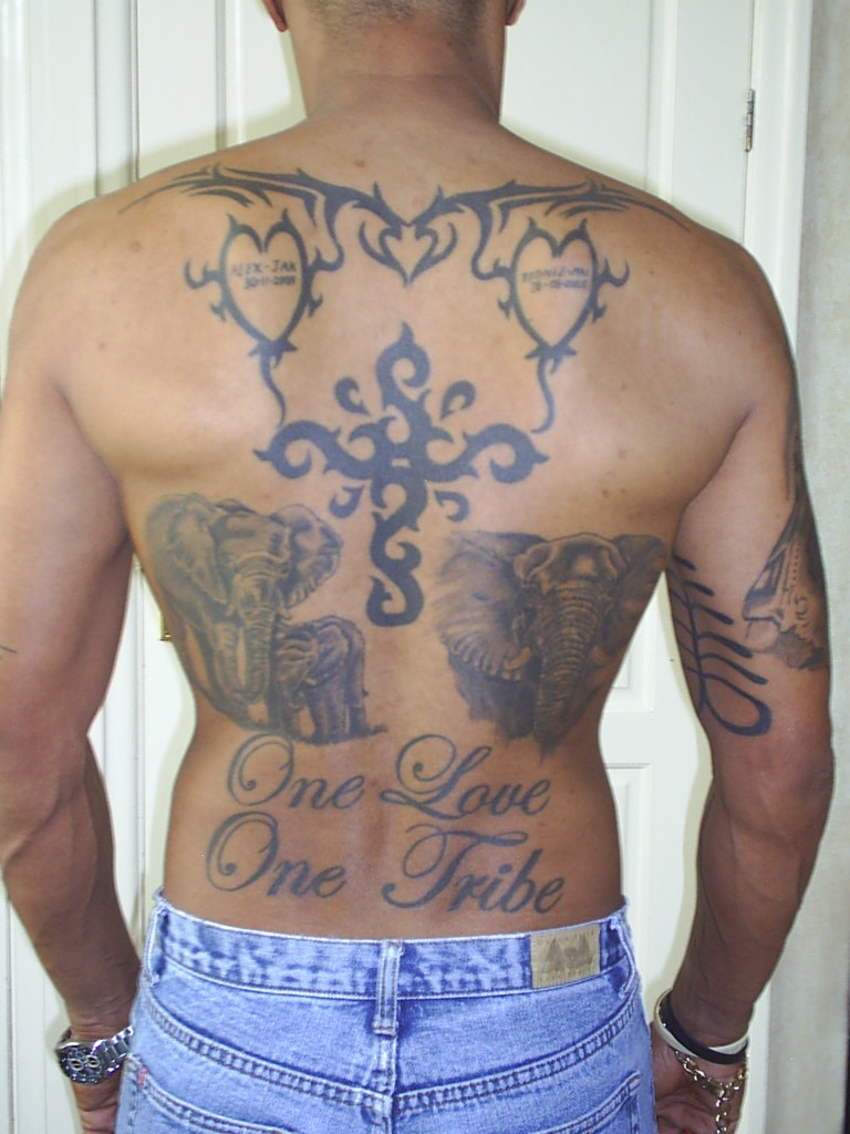 Mixed Tribal And Elephants Back Tattoo