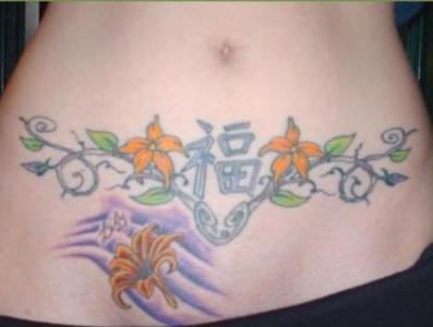 flowers-on-stomach-tattoo-design