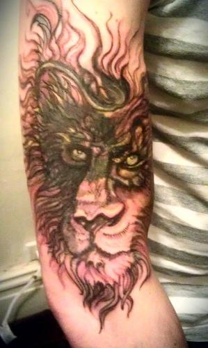 Lion Tattoo on Arm 2tattoodesigns