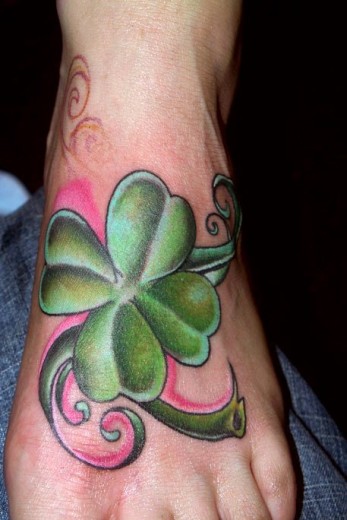 Green Flower Tattoo On Foot