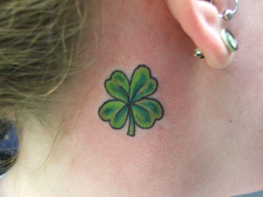 Green Flower Tattoo Behind Ear