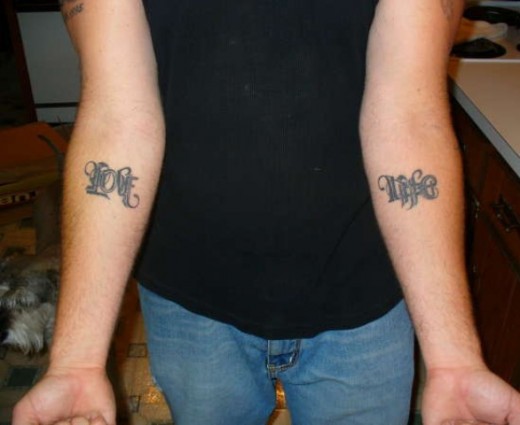 Little Ambigram Tattoo On Both Arms