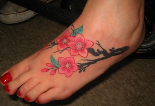 Lovely Flowers Tattoo On Foot