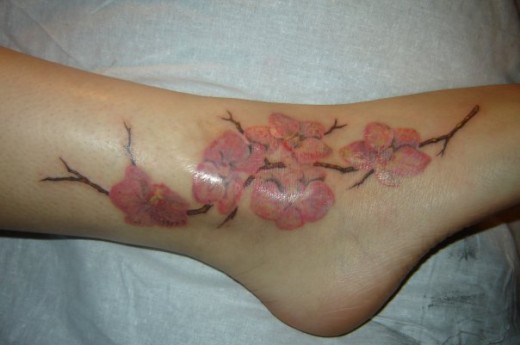 Nice Flowers Tattoo On Ankle
